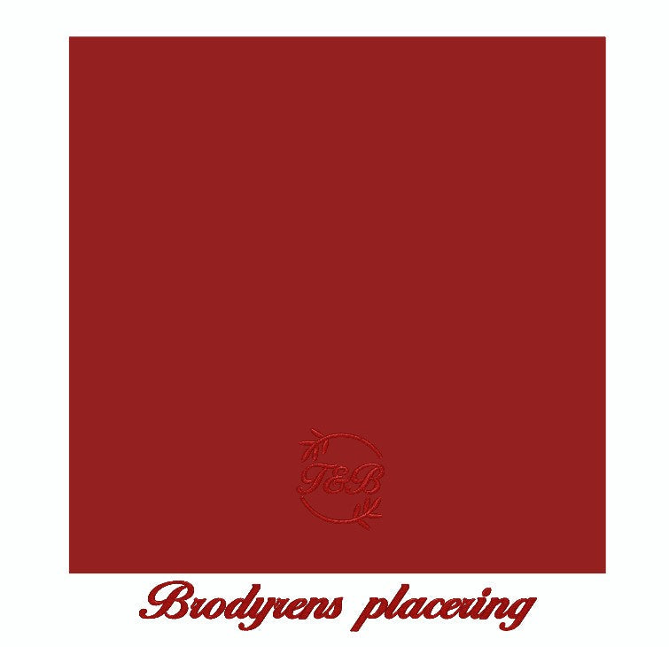 Röda tygservetter av linne med personlig brodyr visar placeringen av brodyren när servetten är ovikt.